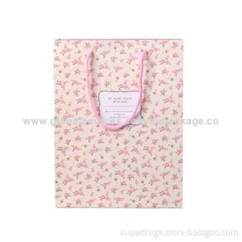 Paper bag with string, quality matte white cardboard and covered